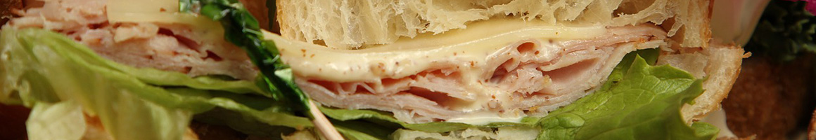 Eating Deli Sandwich at Baires Deli restaurant in Marion, OH.